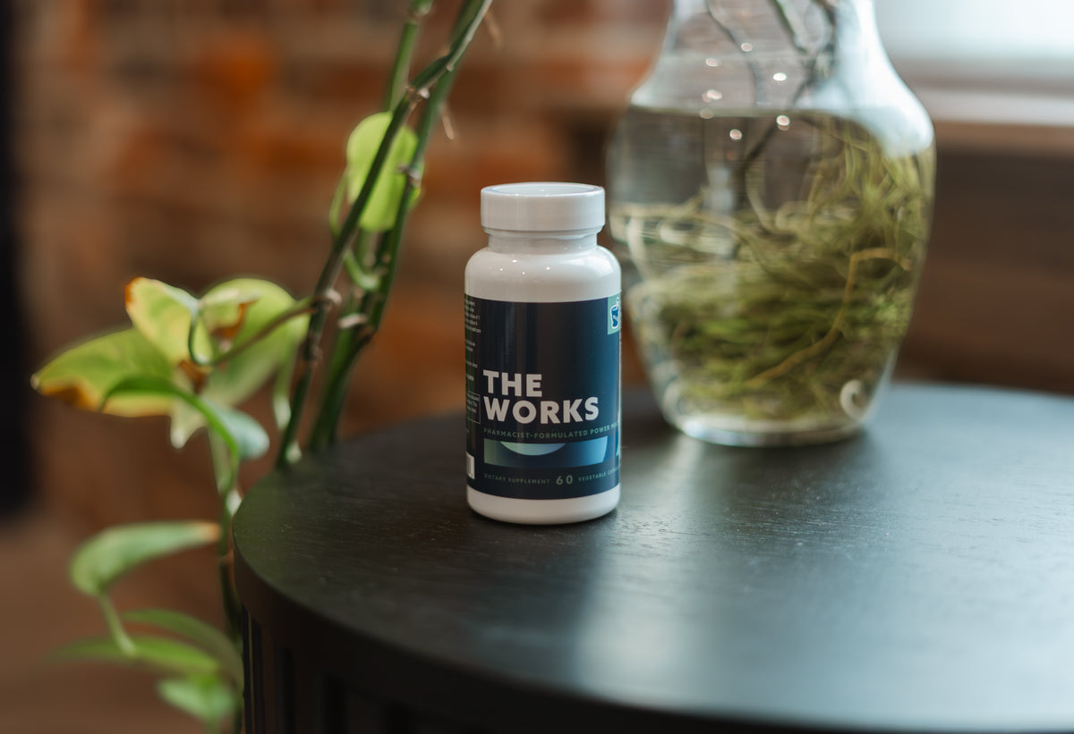 THE WORKS bottle styled on a table at North Century Pharmacy
