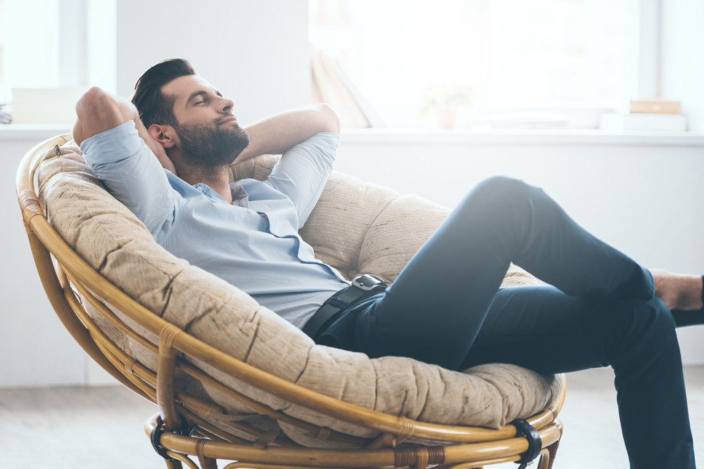 man relaxing in a chair